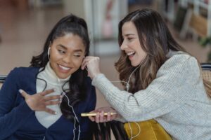 Gen Z listening to podcast sharing headphones. If this is your audience it may be appealing to potential sponsors